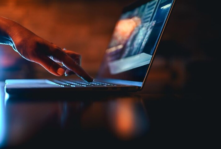 Hand typing on computer keyboard