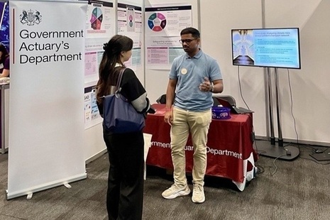 Two people talking at a GAD stall at CSL Liverpool. Credit: Crown copyright