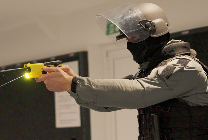 Prison officer with Taser