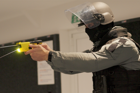 Prison officer with Taser