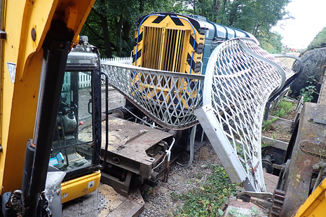 The train and parts of the footbridge involved.
