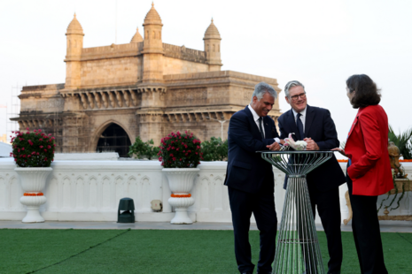 Prime Minister Keir Starmer speaks with Trade Commissioner to South Asia Harjinder Kang and British High Commissioner to India Lindy Cameron in front of the Gateway of India in Mumbai. Picture by Simon Dawson / No 10 Downing Street.