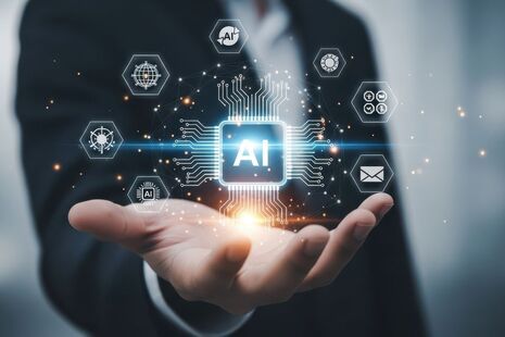 An open hand with an AI symbol floating above the palm.