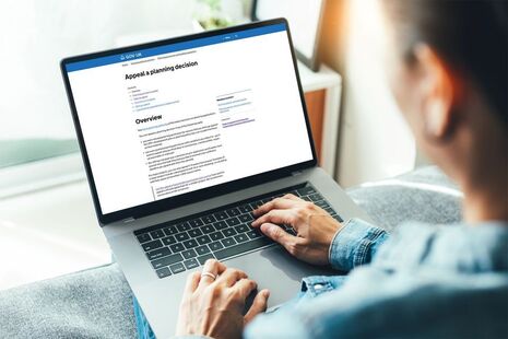 Person sat working on a laptop