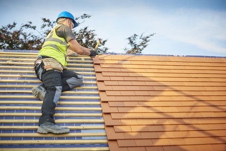 A man working on a roof
