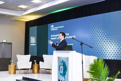 Man presenting at conference.