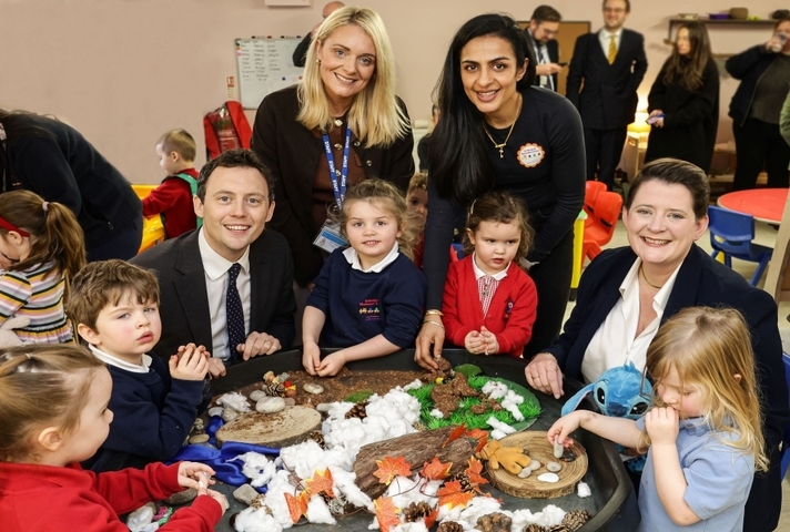 Parliamentary Under-Secretary of State Matthew Patrick and UK Government Minister for Early Years, Olivia Bailey, pictured with children from St Bernard's Pre-School