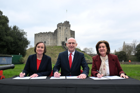 L to R, Jo Stevens, Secretary of State for Wales, The Secretary of State for Defence John Healey and Eluned Morgan, MS, First Minister of Wales, signing the MOU in front of Cardiff castle.
