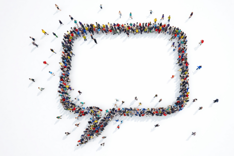 Quotation mark made up of people standing in lines
