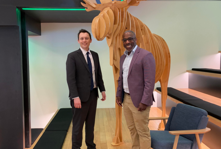 NIO Minister Matthew Patrick pictured with Rapid7 CEO Corey Thomas in their Boston office 