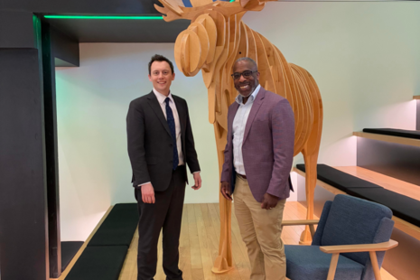 NIO Minister Matthew Patrick pictured with Rapid7 CEO Corey Thomas in their Boston office 