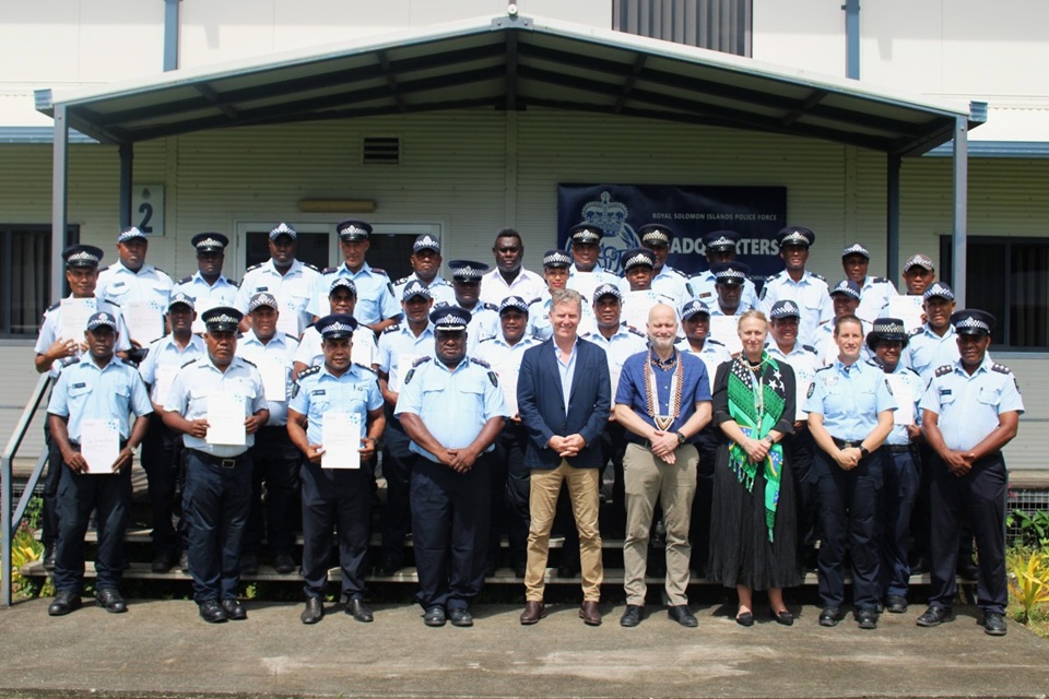 A group photo of the 32 RSIPF officers with High Commissioner Paul Turner.