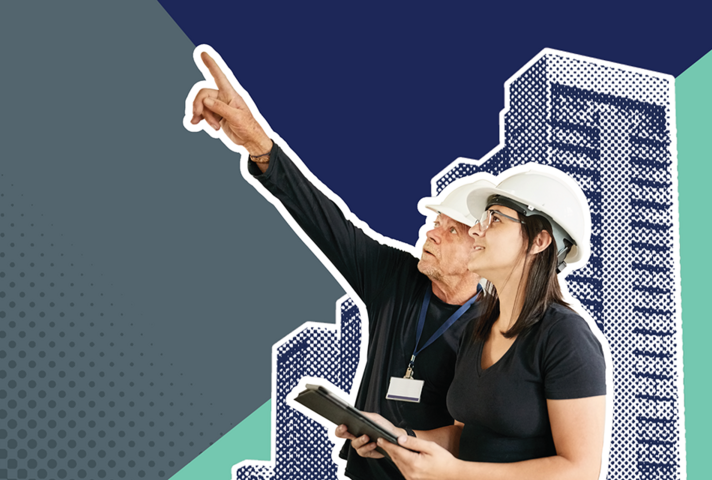 2 people in hard hats surveying a high-rise building