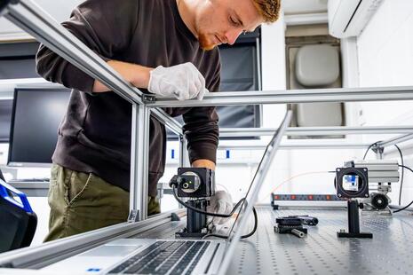 An expert working in the DICE Fusion Diagnostics Laboratory.
