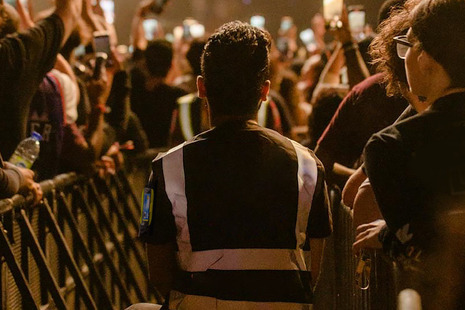 A security guard protecting a crowded event.