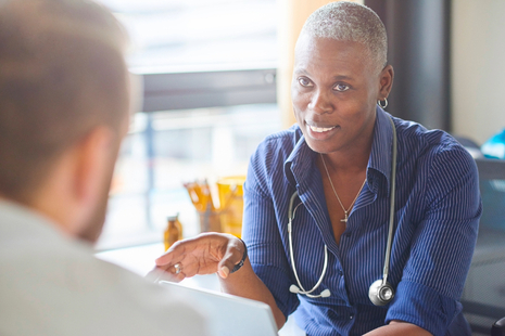 Doctor in conversation with patient.