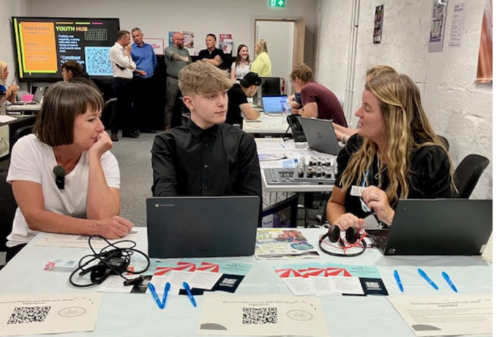 Welsh Secretary Jo Stevens talking with people around a table at Port Talbot Youth Hub