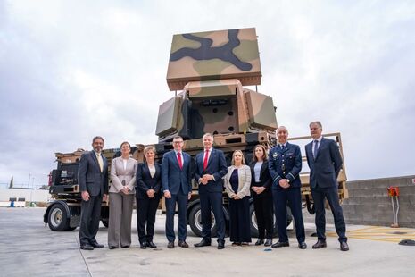 Minister Pollard and Minister Conroy alongside industry in front of the radar. Copyright: CEA