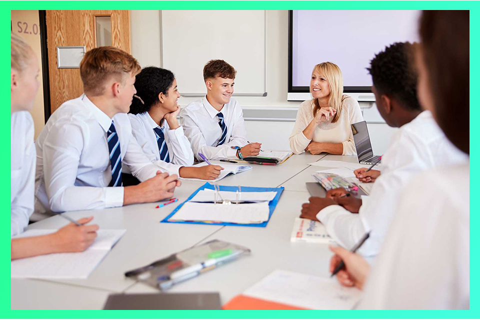A teacher and her pupils in a classroom