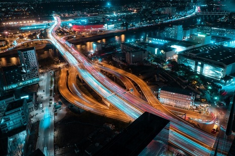 Aerial view of motorway junction at night. Credit: Bastian Nvs, Unsplash