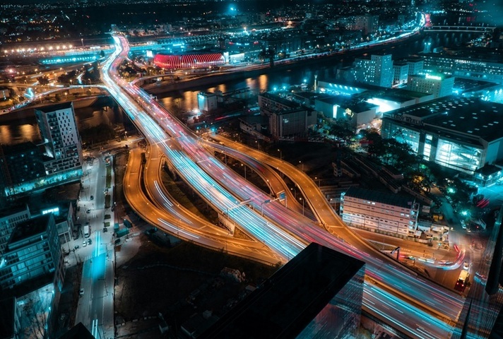 Aerial view of motorway junction at night. Credit: Bastian Nvs, Unsplash