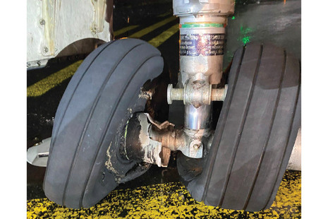 Figure 4 Overload fracture of right nose wheel (left nosewheel similarly damaged)