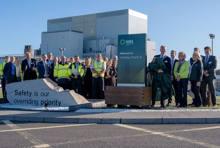NDA Group CEO, David Peattie, unveils NRS sign at Hinkley Point B