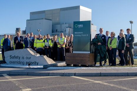 NDA Group CEO, David Peattie, unveils NRS sign at Hinkley Point B