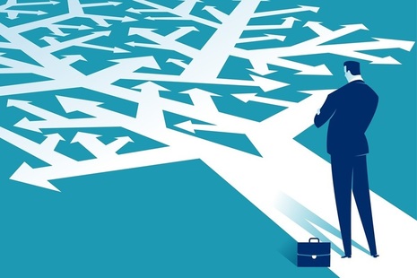 Man looks at arrows on the ground. Credit: Shutterstock